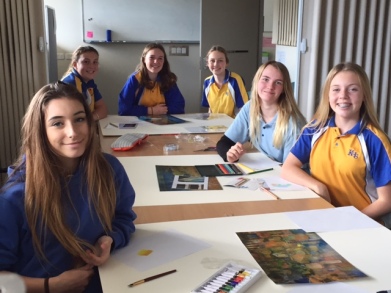 Year 9 art students working on the storyboards for the exhibition
